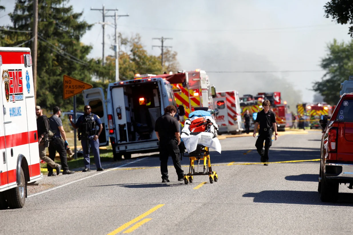 Smoke rises as members of emergency personnel work at the scene of a shooting which took place at the Church of Jesus Christ of Latter-day Saints, according to police, in Grand Blanc, Michigan, U.S., September 28, 2025. REUTERS/Rebecca Cook  TPX IMAGES OF THE DAY/Rebecca Cook