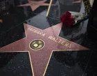 epa10384388 Flowers lay next to the star for Barbara Walters on the Hollywood Walk of Fame in Los Angeles, California, USA, 31 December 2022. The star was dedicated in 2007 for the television pioneer who died at her home in New York City on 30 December 2022 at the age of 93. EPA/DAVID SWANSON/David Swanson