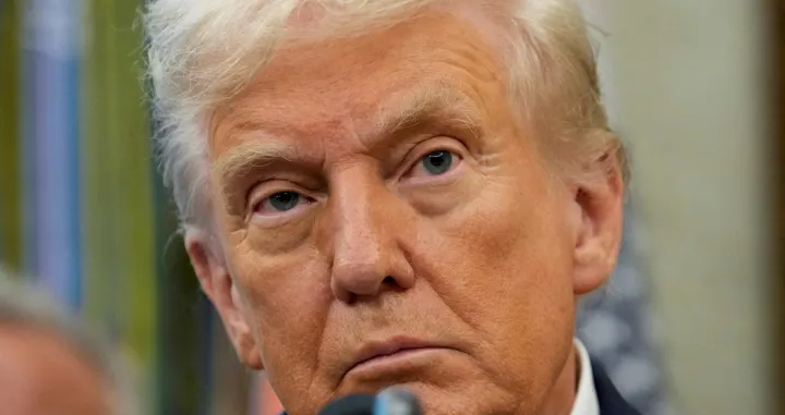 FILE PHOTO: U.S. President Donald Trump looks on as he announces a deal with Pfizer to sell drugs at lower prices, in the Oval office of the White House in Washington, D.C., U.S., September 30, 2025. REUTERS/Ken Cedeno/File Photo/Ken Cedeno