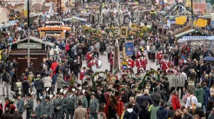 epa10191415 People in traditional clothing participate in the costume parade during the 187th edition of the traditional Oktoberfest beer and amusement festival in the German Bavaria state's capital of Munich, Germany, 18 September 2022. The Oktoberfest 2022 runs from 17 September to 03 October 2022 and several millions of visitors are expected from all over the world. The event resumes after being canceled for two years in a row due to the coronavirus disease (COVID-19) pandemic. EPA/CHRISTIAN BRUNA/Christian Bruna