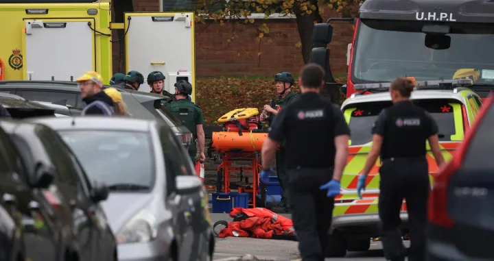 Emergency personnel work at the scene, after a reported attack in which a car was driven at pedestrians and one person was stabbed near a synagogue in north Manchester, Britain, October 2, 2025. REUTERS/Phil Noble/Phil Noble