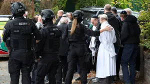 People gather near the scene, after a report of an incident in which a car was driven at pedestrians and a stabbing attack, near a synagogue in north Manchester, Britain, October 2, 2025. REUTERS/Phil Noble/Phil Noble