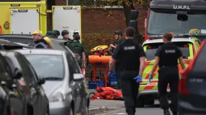 Emergency personnel work at the scene, after a reported attack in which a car was driven at pedestrians and one person was stabbed near a synagogue in north Manchester, Britain, October 2, 2025. REUTERS/Phil Noble/Phil Noble