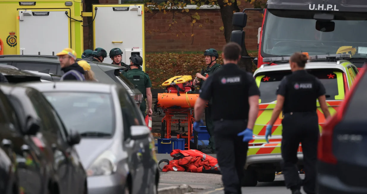 Emergency personnel work at the scene, after a reported attack in which a car was driven at pedestrians and one person was stabbed near a synagogue in north Manchester, Britain, October 2, 2025. REUTERS/Phil Noble/Phil Noble