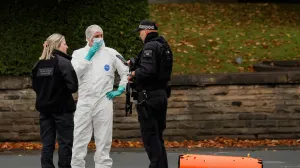 A forensic technician and police officers work at the scene after a man drove a car into pedestrians and stabbed a security guard in an attack at a synagogue where worshippers were marking Yom Kippur, the holiest day on the Jewish calendar, according to the British police, in north Manchester, Britain, October 2, 2025. REUTERS/Phil Noble/Phil Noble