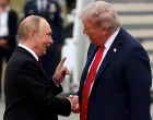 FILE PHOTO: U.S. President Donald Trump shakes hand with Russian President Vladimir Putin, as they meet to negotiate for an end to the war in Ukraine, at Joint Base Elmendorf-Richardson in Anchorage, Alaska, U.S., August 15, 2025. REUTERS/Kevin Lamarque/File Photo/Kevin Lamarque