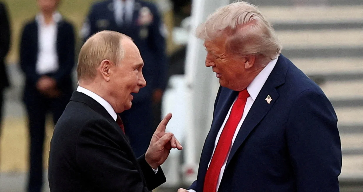 FILE PHOTO: U.S. President Donald Trump shakes hand with Russian President Vladimir Putin, as they meet to negotiate for an end to the war in Ukraine, at Joint Base Elmendorf-Richardson in Anchorage, Alaska, U.S., August 15, 2025. REUTERS/Kevin Lamarque/File Photo/Kevin Lamarque