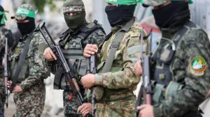 FILE PHOTO: Gunmen stand guard at the funeral of Marwan Issa, a senior Hamas deputy military commander who was killed in an Israeli airstrike during the conflict between Israel and Hamas, amid a ceasefire between Israel and Hamas, in the central Gaza Strip, February 7, 2025. REUTERS/Ramadan Abed/File Photo/Ramadan Abed