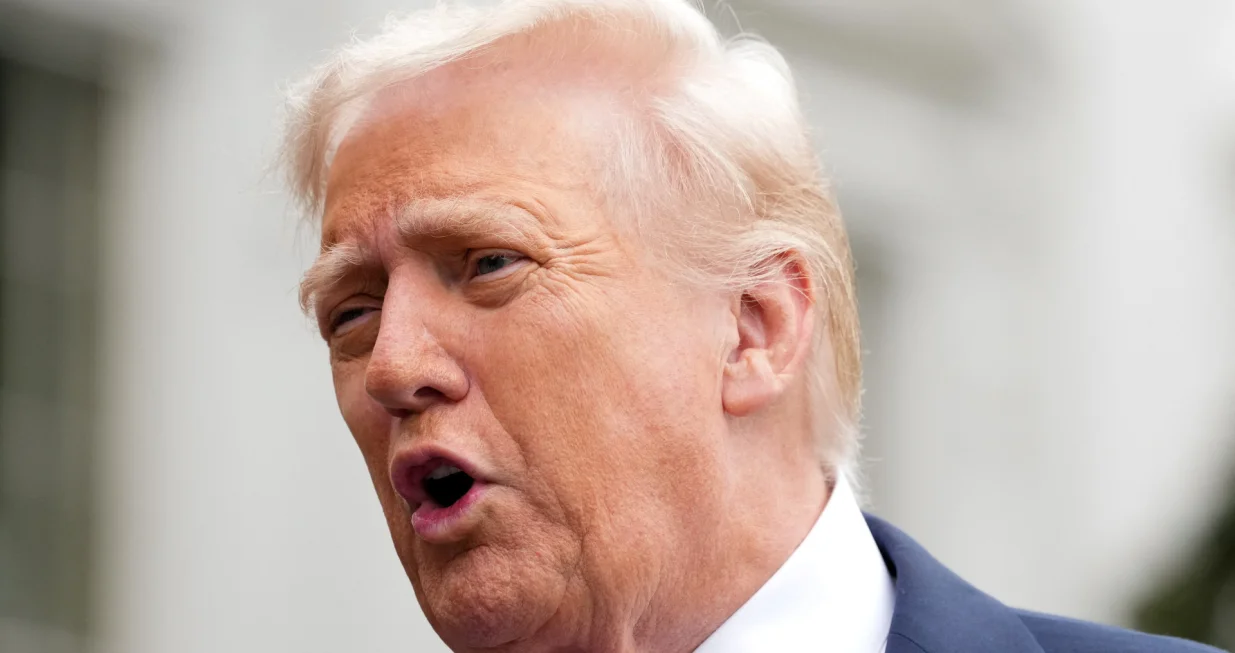 U.S. President Donald Trump speaks to the press before boarding Marine One to depart for Quantico, Virginia, from the South Lawn at the White House in Washington, D.C., U.S., September 30, 2025. REUTERS/Ken Cedeno/Ken Cedeno