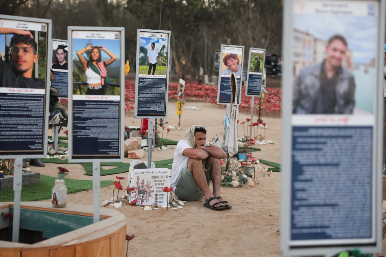 A man sits at the site of the Nova festival where partygoers were killed and kidnapped, on the two-year anniversary of the deadly October 7, 2023 attack on Israel by Hamas from Gaza, in Reim, southern Israel, October 7, 2025. REUTERS/Itay Cohen/Itay Cohen