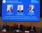 John Clarke, Michel H. Devoret and John M. Martinis are announced this year's Nobel Prize winners in Physics, by the Royal Swedish Academy of Sciences at a press conference in Stockhom, Sweden October 7, 2025. REUTERS/Tom Little/Tom Little
