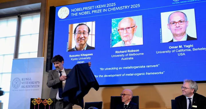 A screen displays the 2025 Nobel Prize laureates in Chemistry, Susumu Kitagawa (Kyoto University, Japan), Richard Robson (University of Melbourne, Australia), and Omar M. Yaghi (University of California, Berkeley, U.S.), as they are announced during a press conference at the Royal Swedish Academy of Sciences in Stockholm, Sweden, October 8, 2025. TT News Agency/Fredrik Sandberg via REUTERS ATTENTION EDITORS - THIS IMAGE WAS PROVIDED BY A THIRD PARTY. SWEDEN OUT. NO COMMERCIAL OR EDITORIAL SALES IN SWEDEN./Fredrik Sandberg/tt
