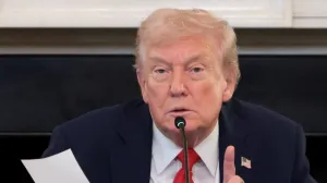 U.S. President Donald Trump holds a note that was handed to him by U.S. Secretary of State Marco Rubio during a roundtable on antifa, an anti-fascist movement Trump designated a domestic "terrorist organization" via executive order on September 22, at the White House in Washington, D.C., U.S., October 8, 2025. REUTERS/Evelyn Hockstein/Evelyn Hockstein