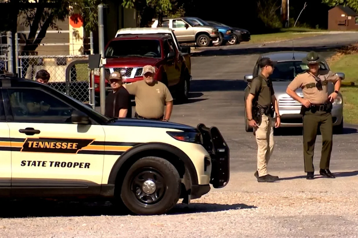 Law enforcement officers guard a gate outside the Accurate Energetic Systems military explosives plant, after an explosion at the facility in Bucksnort, Tennessee, U.S. October 10, 2025 in a still image from video. ABC Affiliate WKRN via REUTERS. NO RESALES. NO ARCHIVES. THIS IMAGE HAS BEEN SUPPLIED BY A THIRD PARTY/Abc Affiliate Wkrn