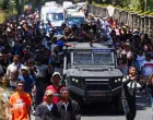 Protesters march alongside a Madagascar military vehicle during a nationwide youth-led protest over frequent power outages and water shortages, in Antananarivo, Madagascar, October 13, 2025. REUTERS/Siphiwe Sibeko/Siphiwe Sibeko