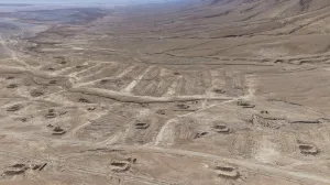 A drone view of the mass grave site in the desert near the eastern Syrian town of Dhumair, February 27, 2025. A Reuters investigation found that the Assad government secretly trucked thousands of bodies there from an exposed mass grave in the Damascus suburb of Qutayfah from 2019-2021. REUTERS/Khalil Ashawi/Khalil Ashawi
