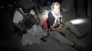 A screengrab from a video shows Swedish activist Greta Thunberg sitting next to a person wearing tactical gear, as vessels of the Global Sumud Flotilla are being intercepted by Israeli security forces, October 1, 2025. Israel Foreign Ministry/Handout via REUTERS THIS IMAGE HAS BEEN SUPPLIED BY A THIRD PARTY. MANDATORY CREDIT. NO RESALES. NO ARCHIVES./Israel Foreign Ministry