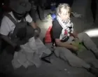 A screengrab from a video shows Swedish activist Greta Thunberg sitting next to a person wearing tactical gear, as vessels of the Global Sumud Flotilla are being intercepted by Israeli security forces, October 1, 2025. Israel Foreign Ministry/Handout via REUTERS THIS IMAGE HAS BEEN SUPPLIED BY A THIRD PARTY. MANDATORY CREDIT. NO RESALES. NO ARCHIVES./Israel Foreign Ministry