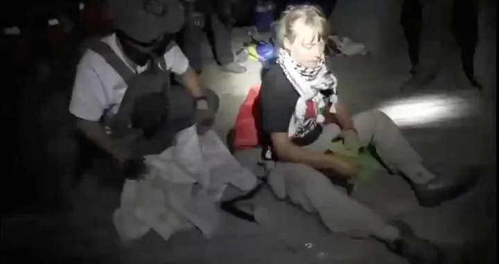 A screengrab from a video shows Swedish activist Greta Thunberg sitting next to a person wearing tactical gear, as vessels of the Global Sumud Flotilla are being intercepted by Israeli security forces, October 1, 2025. Israel Foreign Ministry/Handout via REUTERS THIS IMAGE HAS BEEN SUPPLIED BY A THIRD PARTY. MANDATORY CREDIT. NO RESALES. NO ARCHIVES./Israel Foreign Ministry
