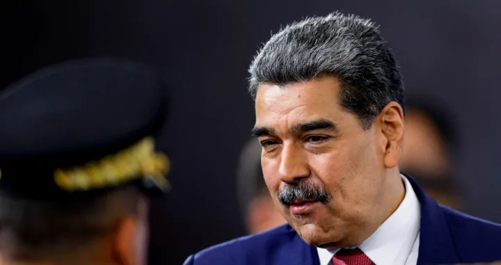 FILE PHOTO: Venezuela's President Nicolas Maduro prepares to leave at the end of a press conference, days after he said Venezuela would deploy military, police and civilian defenses at 284 "battlefront" locations across the country, amid heightened tensions with the U.S., in Caracas, Venezuela, September 15, 2025. REUTERS/Leonardo Fernandez Viloria/File Photo/Leonardo Fernandez Viloria