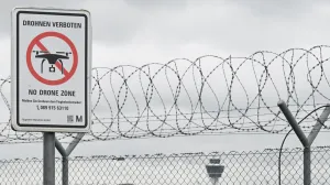 A sign with a drone ban is displayed outside the airport in Munich, Germany October 6, 2025. REUTERS/Angelika Warmuth/Angelika Warmuth