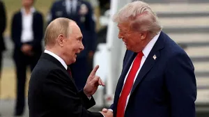 FILE PHOTO: U.S. President Donald Trump shakes hand with Russian President Vladimir Putin, as they meet to negotiate for an end to the war in Ukraine, at Joint Base Elmendorf-Richardson in Anchorage, Alaska, U.S., August 15, 2025. REUTERS/Kevin Lamarque/File Photo/Kevin Lamarque