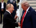 FILE PHOTO: U.S. President Donald Trump shakes hand with Russian President Vladimir Putin, as they meet to negotiate for an end to the war in Ukraine, at Joint Base Elmendorf-Richardson in Anchorage, Alaska, U.S., August 15, 2025. REUTERS/Kevin Lamarque/File Photo/Kevin Lamarque