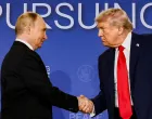 FILE PHOTO: U.S. President Donald Trump and Russian President Vladimir Putin shake hands during a press conference following their meeting to negotiate an end to the war in Ukraine, at Joint Base Elmendorf-Richardson, in Anchorage, Alaska, U.S., August 15, 2025. REUTERS/Kevin Lamarque/File Photo/Kevin Lamarque