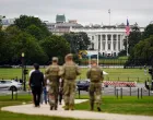 FILE PHOTO: Members of the National Guard walk near the White House on the National Mall after U.S. President Donald Trump deployed the National Guard and ordered an increased presence of federal law enforcement to assist in crime prevention, in Washington, D.C., U.S., August 21, 2025. REUTERS/Al Drago/File Photo/Al Drago