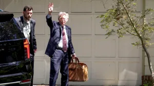 FILE PHOTO: Former White House national security adviser John Bolton arrives at his house following its search by the FBI in Bethesda, Maryland, U.S., August 22, 2025. REUTERS/Tasos Katopodis/File Photo/Tasos Katopodis