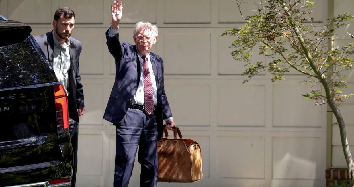 FILE PHOTO: Former White House national security adviser John Bolton arrives at his house following its search by the FBI in Bethesda, Maryland, U.S., August 22, 2025. REUTERS/Tasos Katopodis/File Photo/Tasos Katopodis