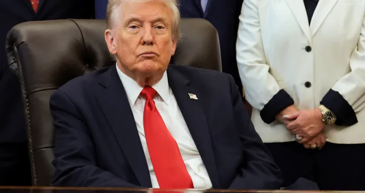 U.S. President Donald Trump looks on during an event to make announcements on fertility treatment coverage, in the Oval Office at the White House in Washington, D.C., U.S., October 16, 2025. REUTERS/Jonathan Ernst/Jonathan Ernst