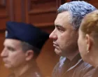 Ukrainian diver Volodymyr Zhuravlov, who is wanted by Germany over his alleged involvement in the 2022 explosions that damaged the Nord Stream pipeline and severely disrupted Russian gas supplies to Europe, listens to the judge's ruling to deny Germany's extradition request and lift his pretrial detention, at the district court in Warsaw, Poland, October 17, 2025. REUTERS/Kuba Stezycki/Kuba Stezycki