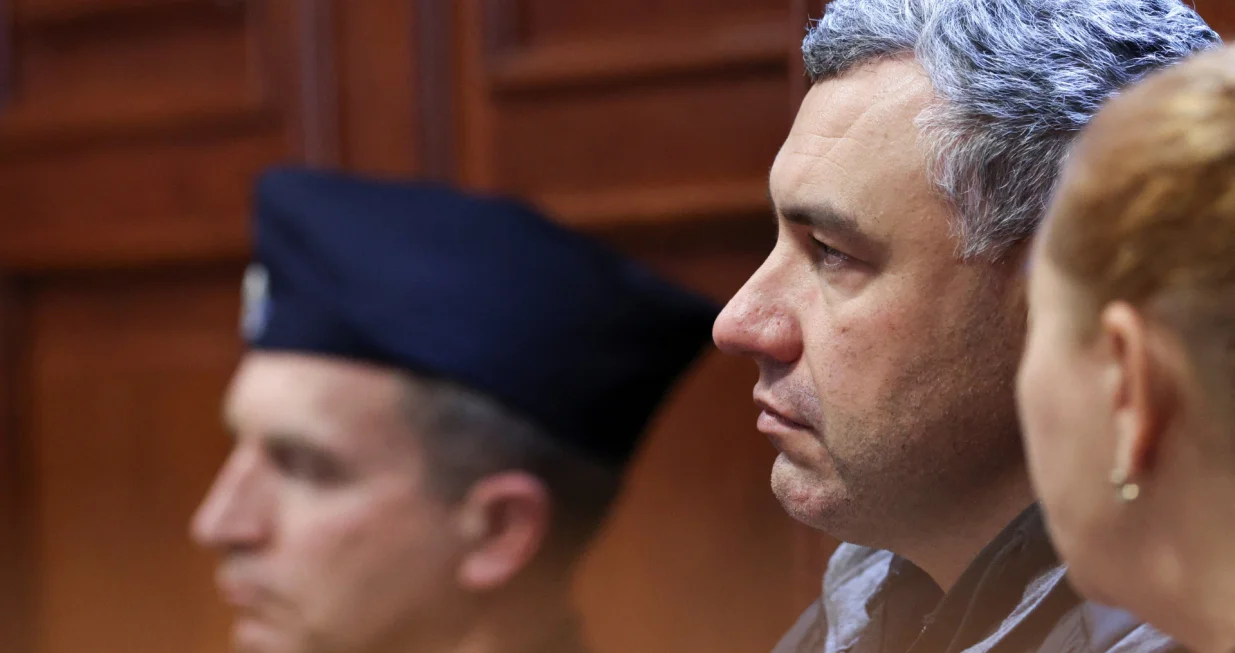 Ukrainian diver Volodymyr Zhuravlov, who is wanted by Germany over his alleged involvement in the 2022 explosions that damaged the Nord Stream pipeline and severely disrupted Russian gas supplies to Europe, listens to the judge's ruling to deny Germany's extradition request and lift his pretrial detention, at the district court in Warsaw, Poland, October 17, 2025. REUTERS/Kuba Stezycki/Kuba Stezycki