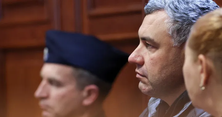 Ukrainian diver Volodymyr Zhuravlov, who is wanted by Germany over his alleged involvement in the 2022 explosions that damaged the Nord Stream pipeline and severely disrupted Russian gas supplies to Europe, listens to the judge's ruling to deny Germany's extradition request and lift his pretrial detention, at the district court in Warsaw, Poland, October 17, 2025. REUTERS/Kuba Stezycki/Kuba Stezycki