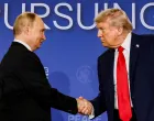 FILE PHOTO: U.S. President Donald Trump and Russian President Vladimir Putin shake hands during a press conference following their meeting to negotiate an end to the war in Ukraine, at Joint Base Elmendorf-Richardson, in Anchorage, Alaska, U.S., August 15, 2025. REUTERS/Kevin Lamarque/File Photo/Kevin Lamarque