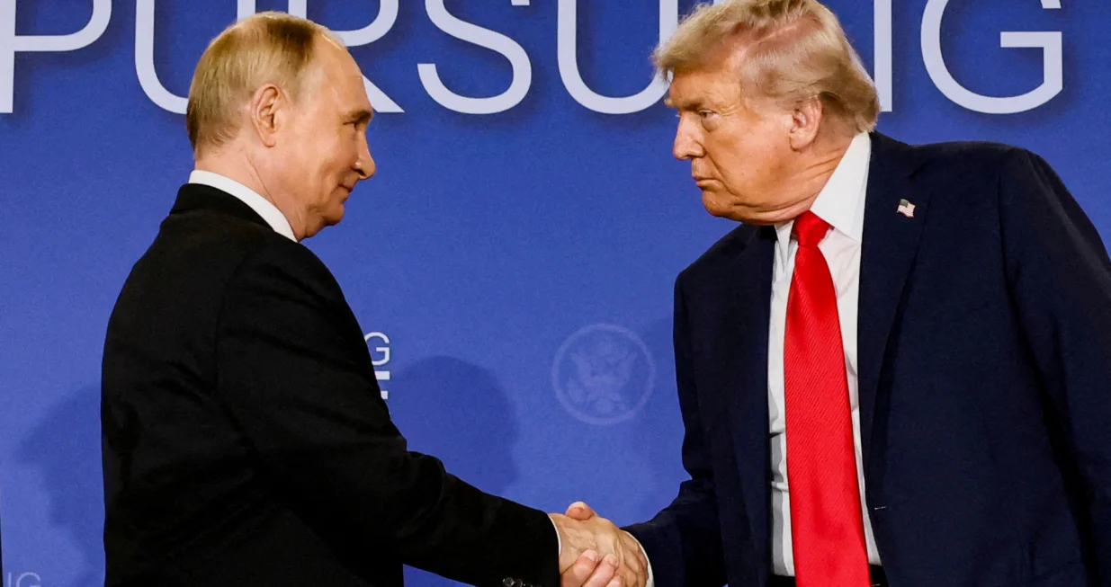 FILE PHOTO: U.S. President Donald Trump and Russian President Vladimir Putin shake hands during a press conference following their meeting to negotiate an end to the war in Ukraine, at Joint Base Elmendorf-Richardson, in Anchorage, Alaska, U.S., August 15, 2025. REUTERS/Kevin Lamarque/File Photo/Kevin Lamarque