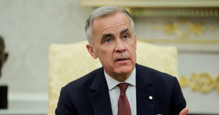 FILE PHOTO: Canada's Prime Minister Mark Carney speaks as he and U.S. President Donald Trump (not pictured) meet in the Oval Office at the White House in Washington, D.C., U.S., October 7, 2025. REUTERS/Evelyn Hockstein/File Photo/Evelyn Hockstein
