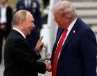 FILE PHOTO: U.S. President Donald Trump shakes hand with Russian President Vladimir Putin, as they meet to negotiate for an end to the war in Ukraine, at Joint Base Elmendorf-Richardson in Anchorage, Alaska, U.S., August 15, 2025. REUTERS/Kevin Lamarque/File Photo/Kevin Lamarque