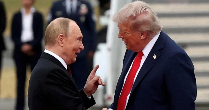 FILE PHOTO: U.S. President Donald Trump shakes hand with Russian President Vladimir Putin, as they meet to negotiate for an end to the war in Ukraine, at Joint Base Elmendorf-Richardson in Anchorage, Alaska, U.S., August 15, 2025. REUTERS/Kevin Lamarque/File Photo/Kevin Lamarque