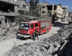 A member of the civil defense walks next to a fire truck as the team searches for bodies trapped under the rubble of destroyed buildings, amid a severe lack of equipment and capabilities needed to recover the victims, according to Palestinian Civil Defense, in Gaza City, October 20, 2025. REUTERS/Ebrahim Hajjaj/Ebrahim Hajjaj