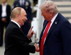 FILE PHOTO: U.S. President Donald Trump shakes hand with Russian President Vladimir Putin, as they meet to negotiate for an end to the war in Ukraine, at Joint Base Elmendorf-Richardson in Anchorage, Alaska, U.S., August 15, 2025. REUTERS/Kevin Lamarque/File Photo/Kevin Lamarque