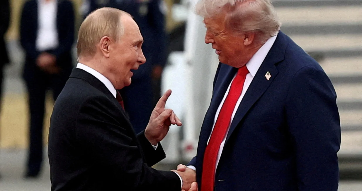 FILE PHOTO: U.S. President Donald Trump shakes hand with Russian President Vladimir Putin, as they meet to negotiate for an end to the war in Ukraine, at Joint Base Elmendorf-Richardson in Anchorage, Alaska, U.S., August 15, 2025. REUTERS/Kevin Lamarque/File Photo/Kevin Lamarque