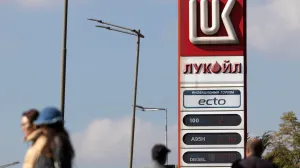 People walk near a Lukoil gas station in Sofia, Bulgaria, October 23, 2025. REUTERS/Stoyan Nenov/Stoyan Nenov