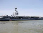 FILE PHOTO: Pre-Commissioning Unit Gerald R. Ford (CVN 78) is maneuvered by tug boats in the James River during the aircraft carrier's turn ship evolution in Newport News, Virginia, U.S. June 11, 2016. To match Special Report USA-TRUMP/CARRIERS  U.S. Navy/Mass Communication Specialist Seaman Apprentice Gitte Schirrmacher/Handout via REUTERS ATTENTION EDITORS - THIS PHOTO WAS PROVIDED BY A THIRD PARTY. EDITORIAL USE ONLY/File Photo/Handout.