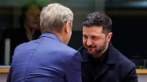 Ukrainian President Volodymyr Zelenskiy is welcomed by Poland's Prime Minister Donald Tusk at the European Union leaders' summit in Brussels, Belgium October 23, 2025. REUTERS/Yves Herman/Pool/Yves Herman