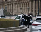 Forensic police officers arrive at the Louvre museum after reports of a robbery, in Paris, France, October 19, 2025. REUTERS/Gonzalo Fuentes/Gonzalo Fuentes