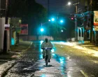 A man wearing a protective suit cycles on a street, as Hurricane Melissa approaches, in Kingston, Jamaica, October 27, 2025. REUTERS/Octavio Jones  TPX IMAGES OF THE DAY/Octavio Jones