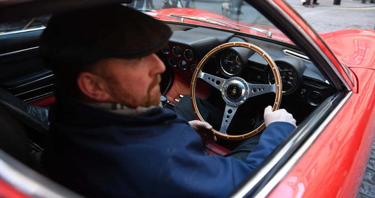 epa10367148 A 1969 Lamborghini Miura P400S Coup&eacute; is driven ahead of the Important Collectors' Motor Cars and Automobilia at Bonhams in London, Britain, 15 December 2022. The auction takes place on 16 December 2022. EPA/NEIL HALL/Neil Hall