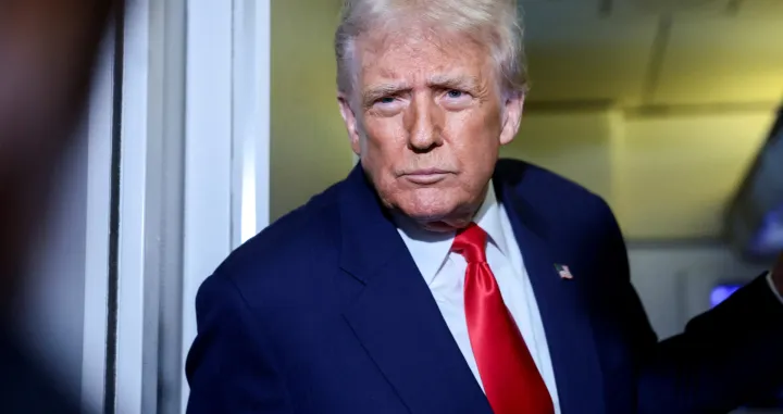 FILE PHOTO: U.S. President Donald Trump speaks to members of the media on board Air Force One en route to the U.S., October 30, 2025. REUTERS/Evelyn Hockstein/File Photo/Evelyn Hockstein